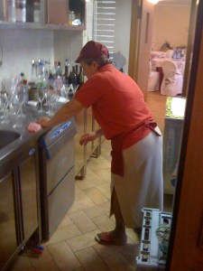 Marisa valiantly trying to put the kitchen in order before she must cook again for dinner!