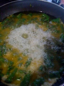 Adding some shredded pecorino as the eggs are setting